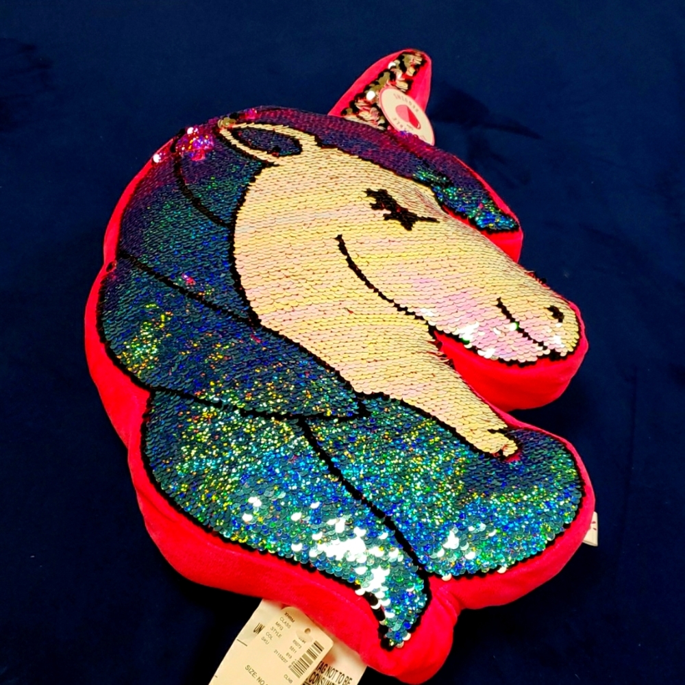 Adorable Justice flippy sequence pillow. Perfect for sleep overs or parties.